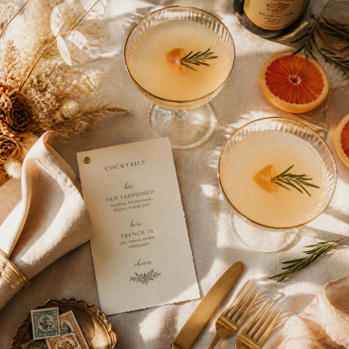 Overhead cocktail flat lay with gold flatware